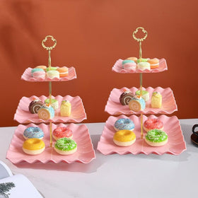 RAUVOLFIA cupcake stand enhances tea parties and buffets with charm.