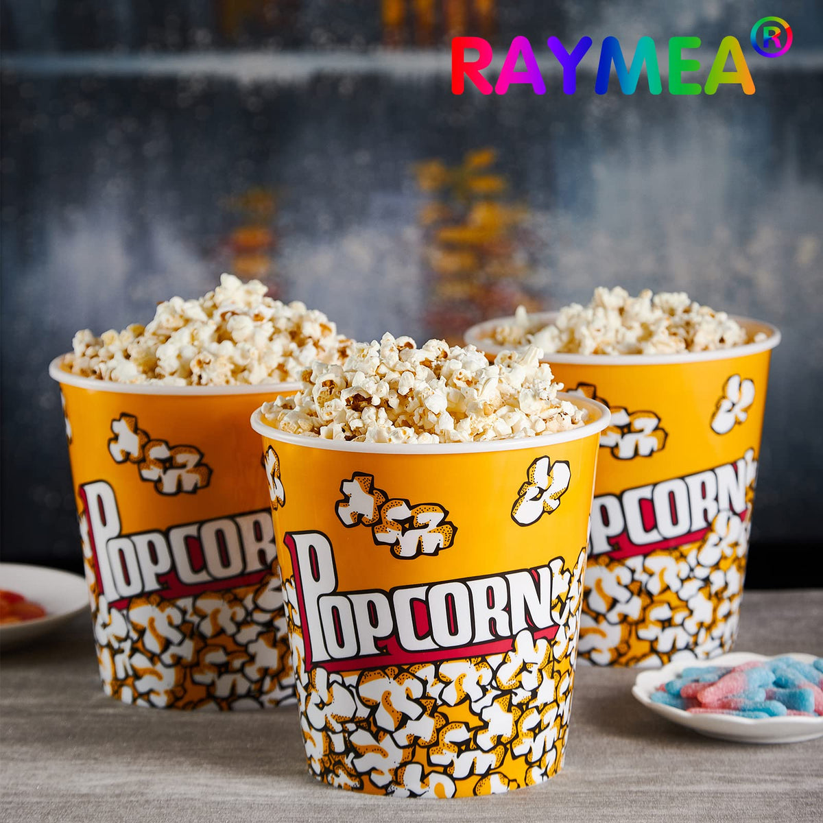 RAYMEA popcorn buckets on table for holiday display and gifts.