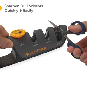 RAZORSHARP knife sharpener professional-use angle-guide in a busy kitchen setting.