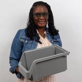 ReadySpace stackable heavy-duty plastic bin keeps tools neatly organized on garage shelves.