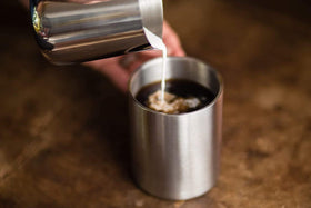 Real Deal Steel camping-ready mug designed for rugged outdoor adventures.