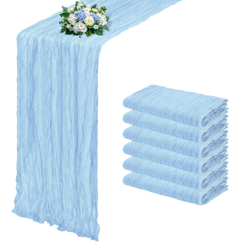 RealBox baby blue cheesecloth table runner drapes elegantly on a rustic wedding table.