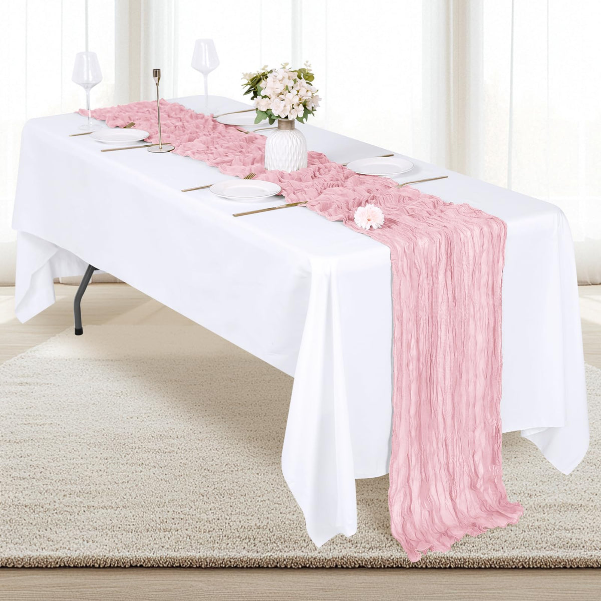 RealBox baby shower table setting with soft pink semi-sheer fabric.