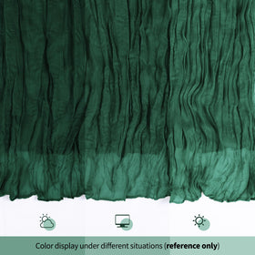 Pleated table runner creates sophisticated centerpiece under soft lighting