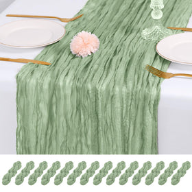 RealBox sage green cheesecloth table runner close-up showing soft drape and texture for elegant tables