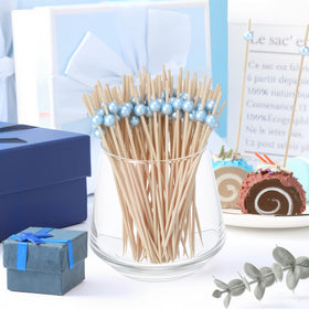 Reallnaive pearl-end skewers at a wedding or bridal party setup.