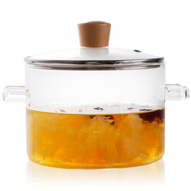 Recceng glass pot on the stovetop simmering water for efficient cooking.