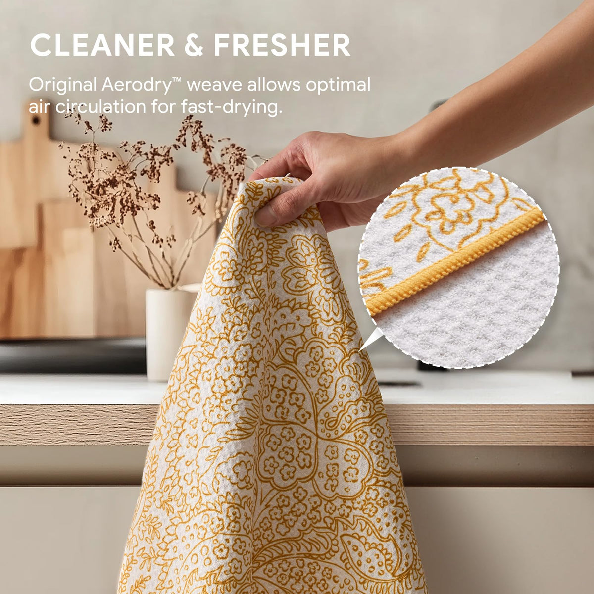 RECYCO Waffle Kitchen Towel Marigold Mosaic hanging loop keeps towels accessible.