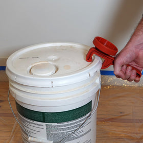 Red Devil 4039 ergonomic handle eases bucket opening during painting projects.