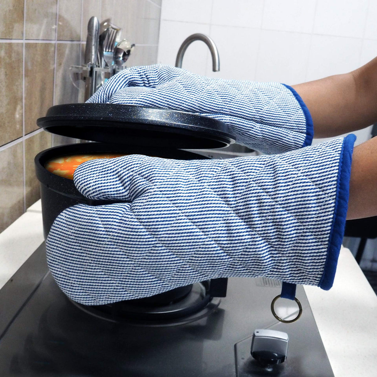Red LMLDETA blue oven mitt protects hands during microwave use.