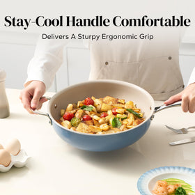 Redchef pan close-up of ergonomic double-riveted handle ensures a secure grip.