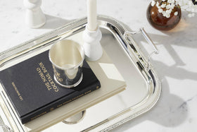 Reed & Barton tray shows baroque handles for an elevated serving look.