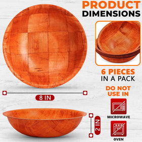 Reluen wooden bowls on a festive table ready for serving pasta