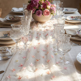 Remagr long table decor featuring dark tulle and spring butterfly patterns