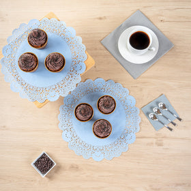 Moisture-absorbing Pastry Tek doilies protect surfaces during service