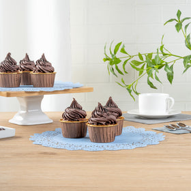 Petit fours showcased on lace doilies for a sophisticated look
