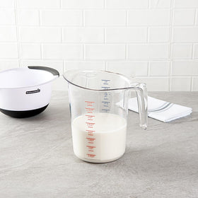 Restaurantware measuring jar with thumb-grip handle provides secure pouring.