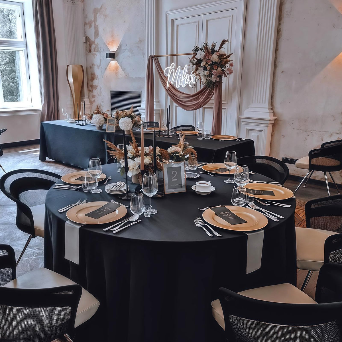 RestfulGlow 8-pack black round tablecloth set on a wedding table for guests