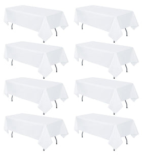 RestfulGlow 8-pack white tablecloth on a 60x126 inch rectangle table for elegant events.