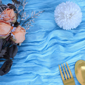 RestfulGlow baby blue cheesecloth table runner 10ft adds soft texture to dining.