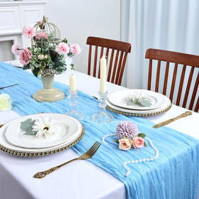 RestfulGlow cheesecloth table runner used as backdrop drape for wedding or party decor