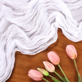 RestfulGlow backdrop drape at a wedding using the table runner to create airy elegance.