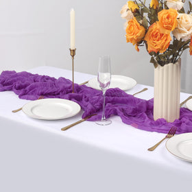 RestfulGlow boho picnic setup featuring purple cheesecloth table runner