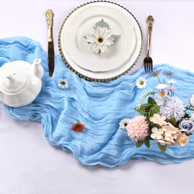 RestfulGlow party decor with baby blue cheesecloth runner accenting the tables