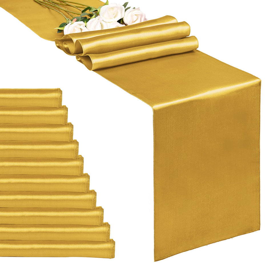 REWOMC gold satin table runner on a luxurious banquet table.
