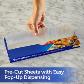 Parchment sheet laid flat on a pan to prevent curling and ensure even coverage