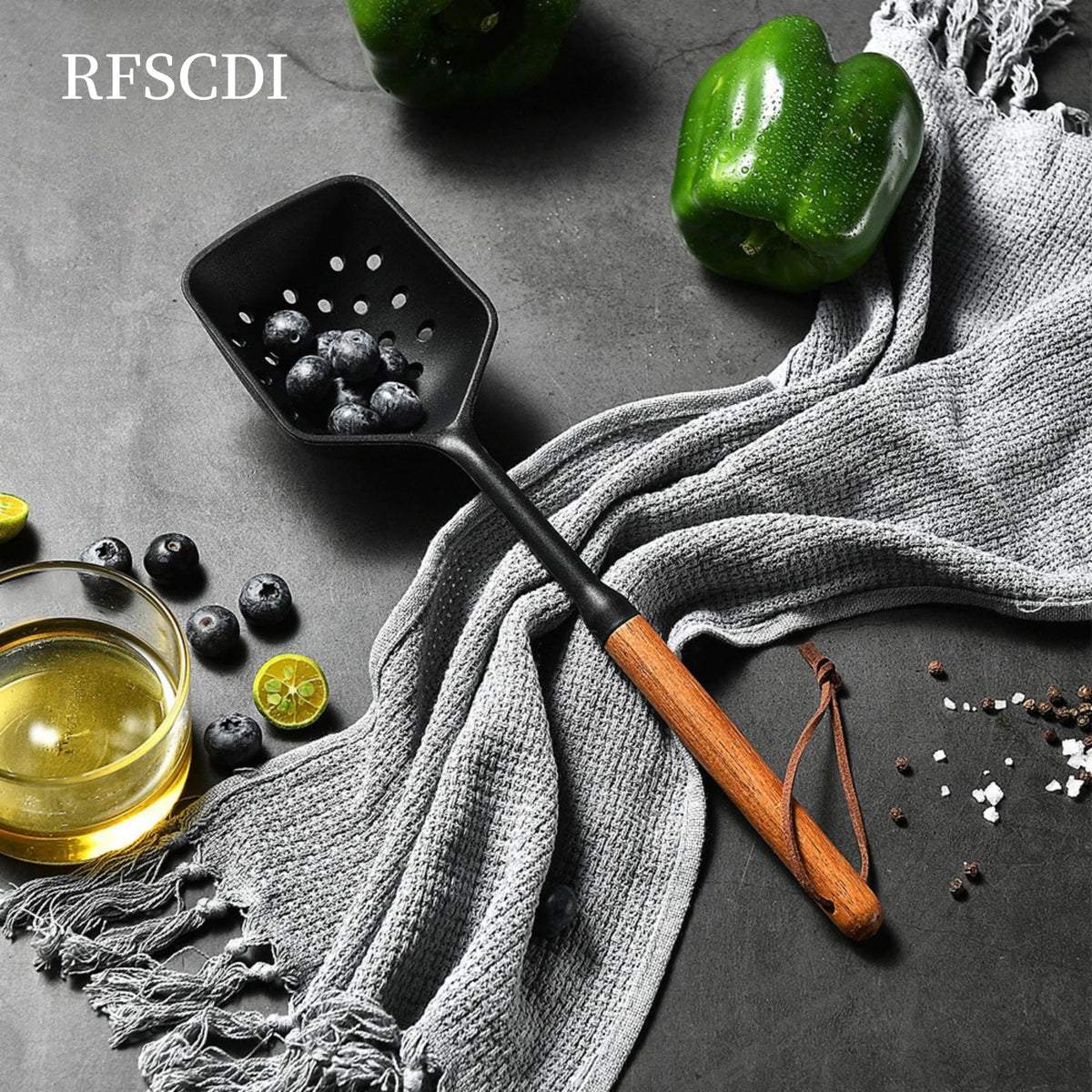 RFSCDI slotted silicone spoon for draining sauces during cooking.