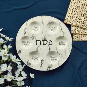 Ceramic Seder plate with bilingual labels for modern table styling.