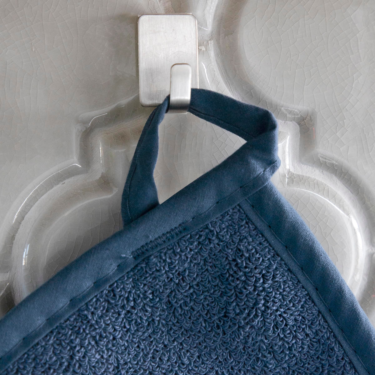 RITZ Royale Terry potholder hangs via loop for easy access in the kitchen.