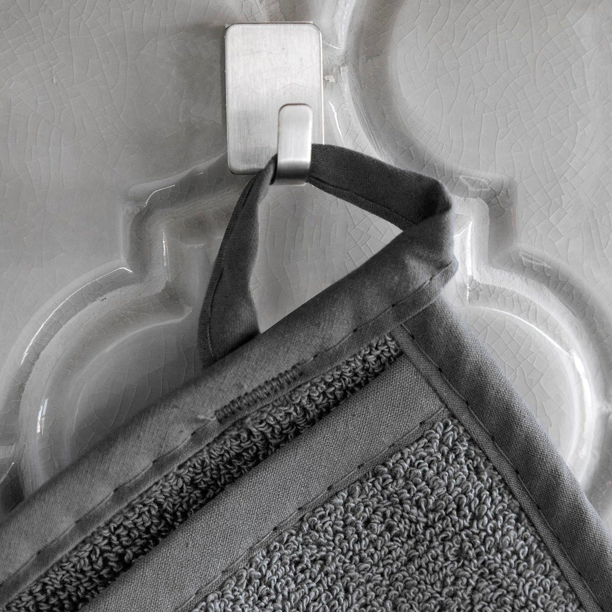 RITZ Terry Pocket Mitt graphite hanging loop demonstrates convenient storage and quick reach.