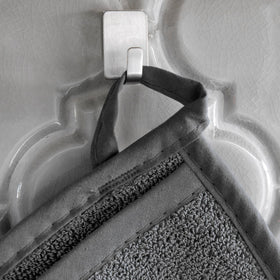 RITZ Terry Pocket Mitt graphite hanging loop demonstrates convenient storage and quick reach.