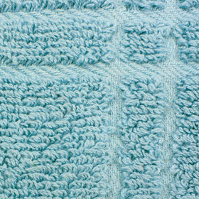 Ritz tie towel check dew draped over a refrigerator handle for easy reach