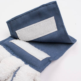 Ritz tie towel hanging on oven bar for easy reach in busy kitchens.