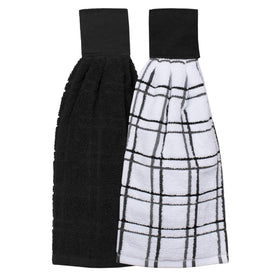 Ritz tie towel solid black mounted on oven bar for quick access.