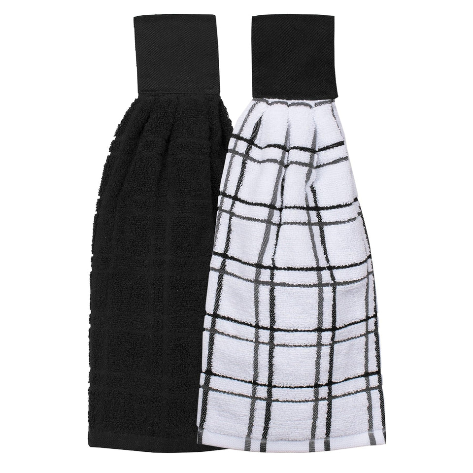 Ritz tie towel solid black mounted on oven bar for quick access.