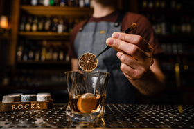 ROCKS WHISKEY CHILLING STONES on bar cart ready for gifting.