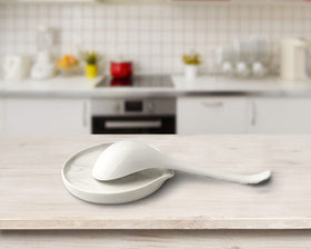 Roeveca spoon rest close-up reveals marble glaze and ceramic quality.
