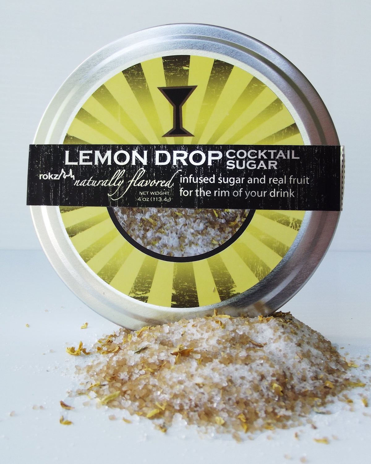 Rokz lemon wedge being rimmed with citrus sugar for a zesty garnish.