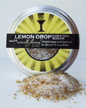 Rokz lemon wedge being rimmed with citrus sugar for a zesty garnish.