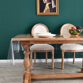 Romanstile clear tablecloth on dining table protects surfaces from spills