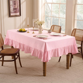 Romanstile close-up shows delicate ruffles framing the gingham edge.