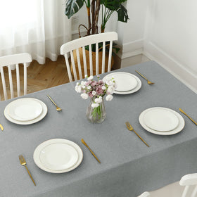 Romanstile dining and party setup with a cohesive faux linen look.