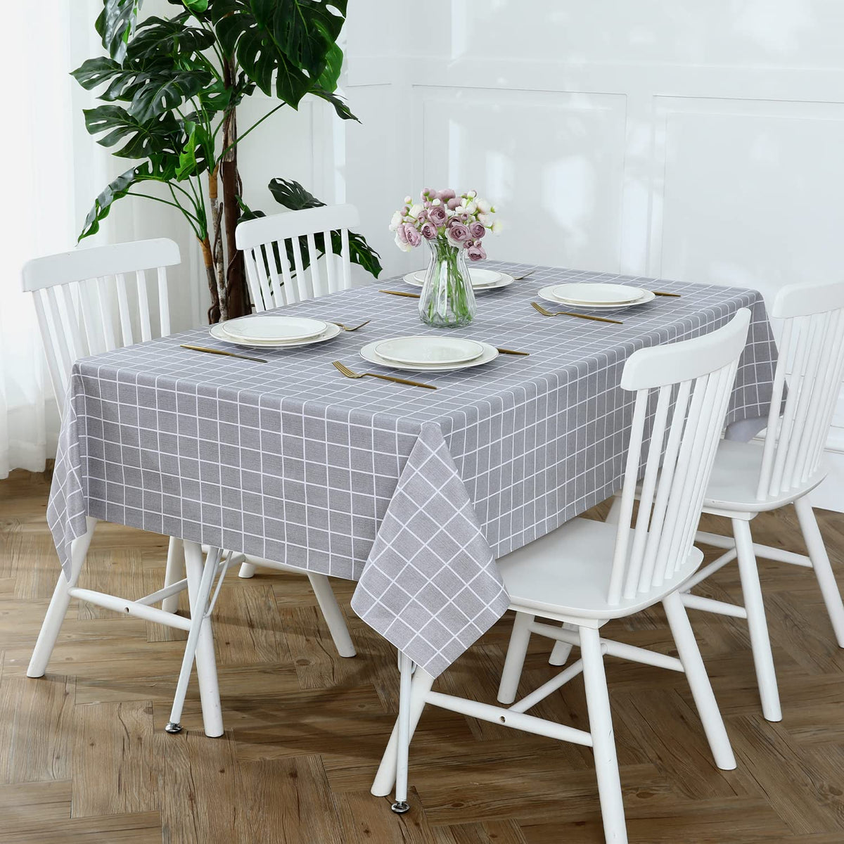 Romanstile heavy-duty vinyl tablecloth protects furniture from stains, heat, and scratches.