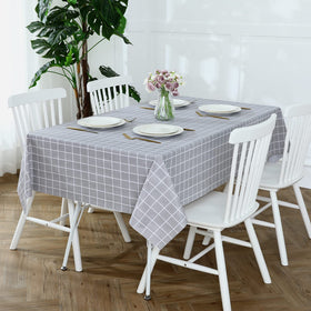 Romanstile heavy-duty vinyl tablecloth protects furniture from stains, heat, and scratches.