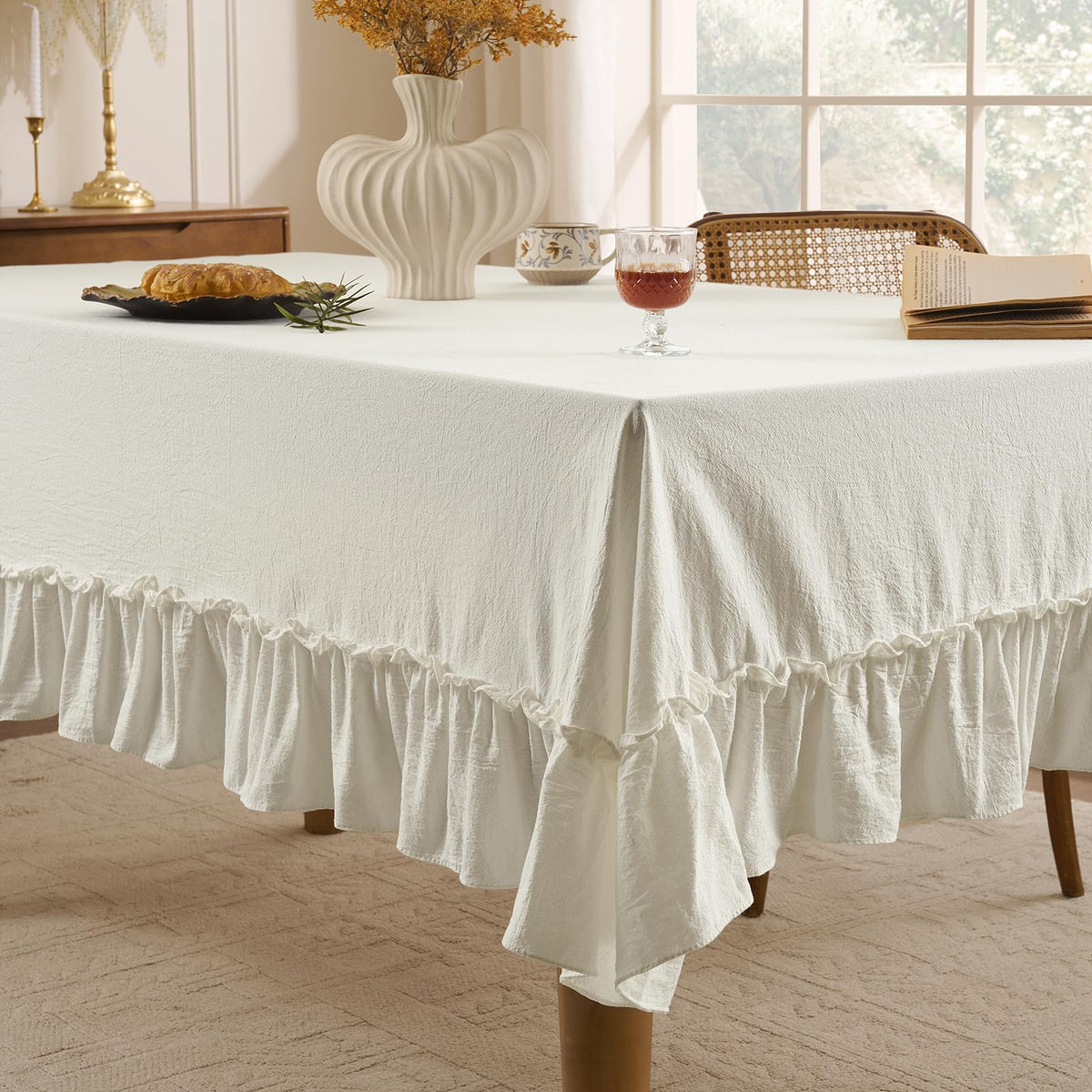 Romanstile rectangle tablecloth draped over table showing graceful drape