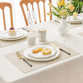 Romanstile vinyl placemats beige closeup highlights texture and heat protection for hot dishes.
